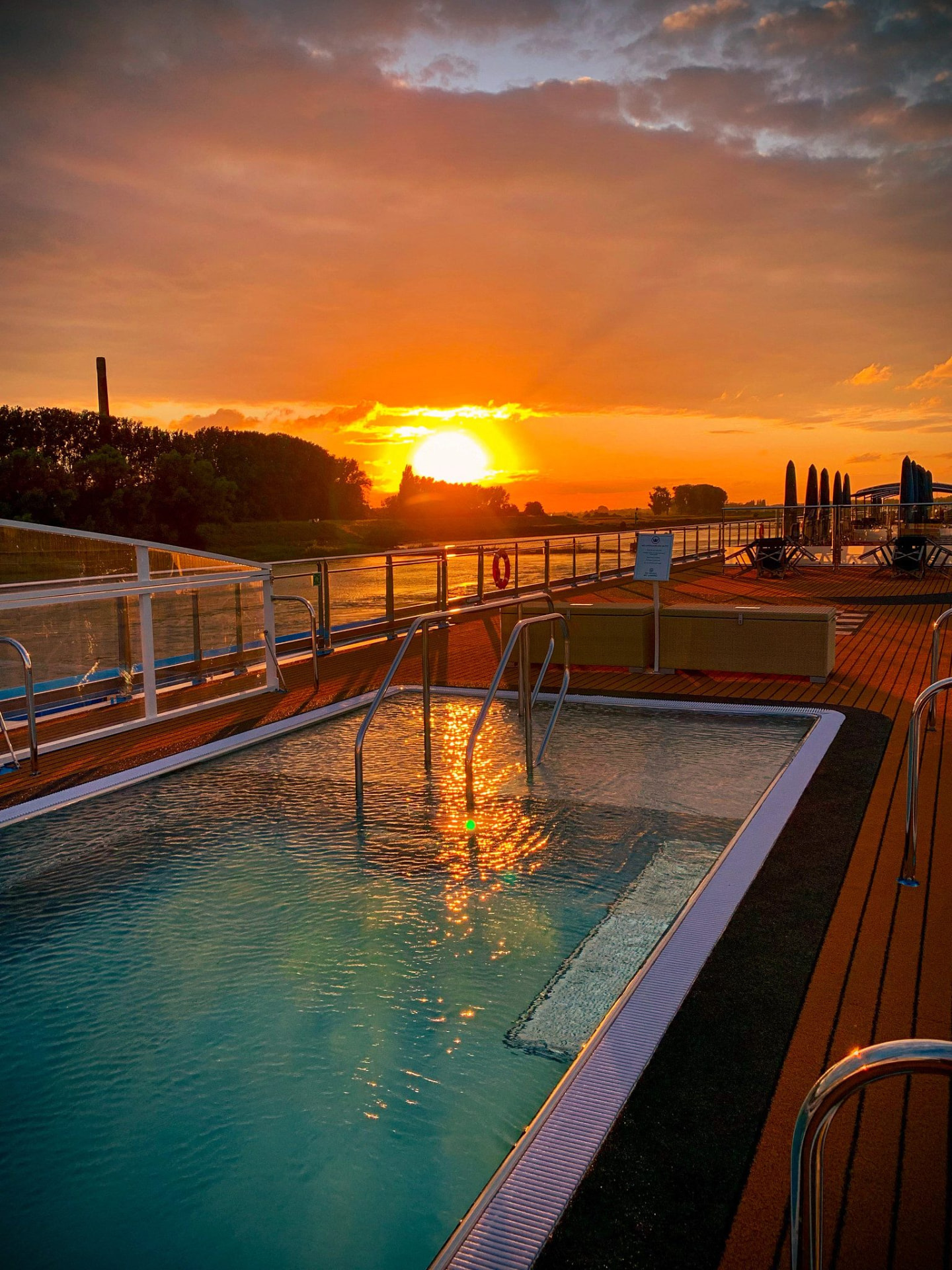 A sunset glowing over the pool deck of an AmaWaterways river ship.